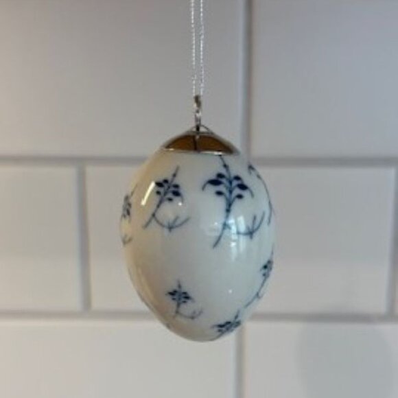 Royal Copenhagen Porcelain Blue Fluted Egg Ornament in Nest - 2.5 Inches - Picture 1 of 4